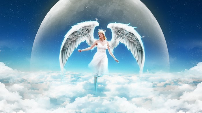 Angel with large wings in the sky