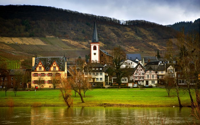 Village with church and river in Germany