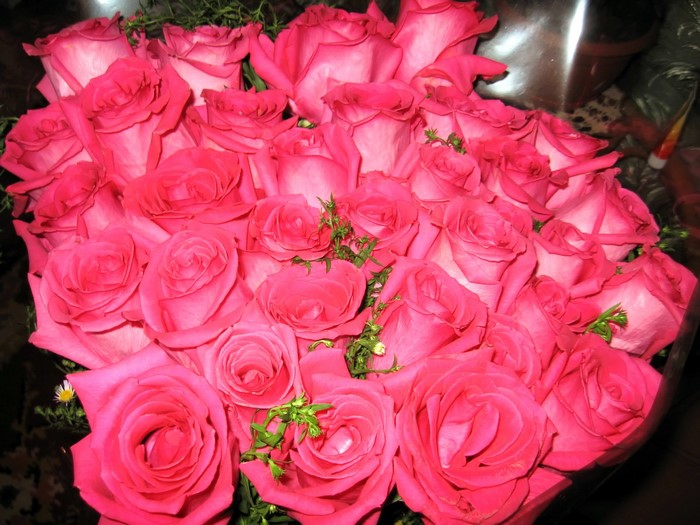 A large bouquet of pink roses