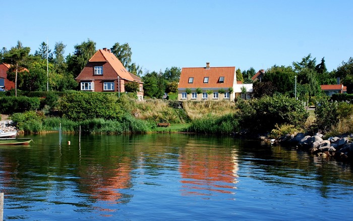 Houses on a hill overlooking a body of water in Denmark