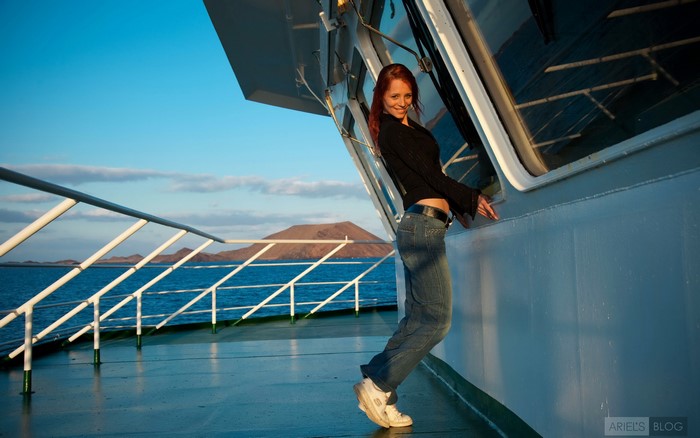 Redhead girl on a ferry deck
