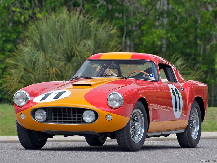 Red and yellow Ferrari race car with number 11