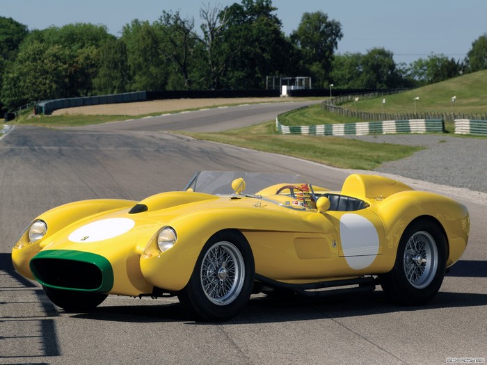 Yellow Ferrari 500 TRC Spider on a Race Track