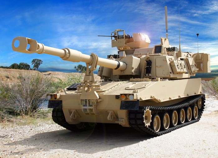 Self-propelled howitzer in a desert landscape