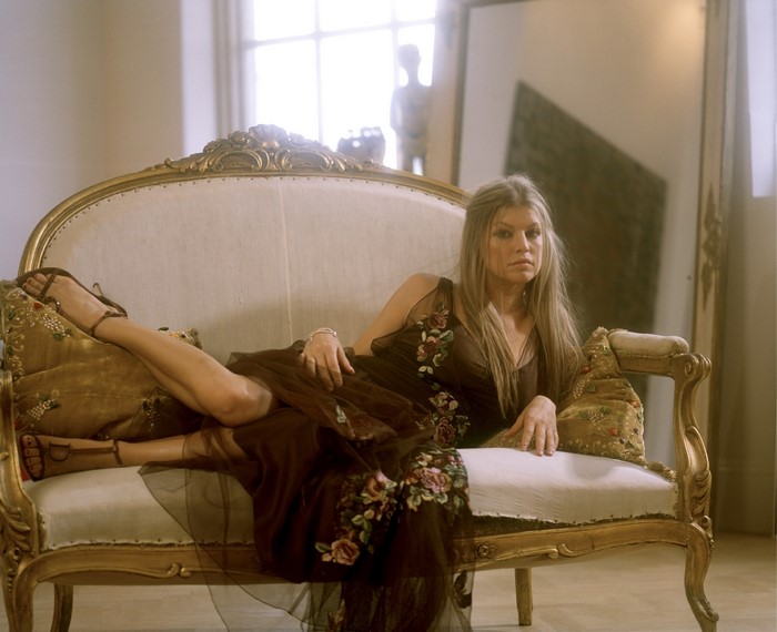 Stacy Ferguson on a couch