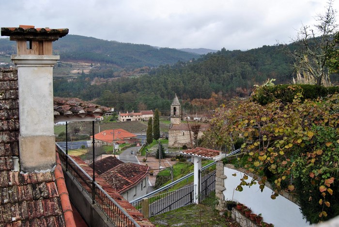 Village with church and tiled roofs in Spain
