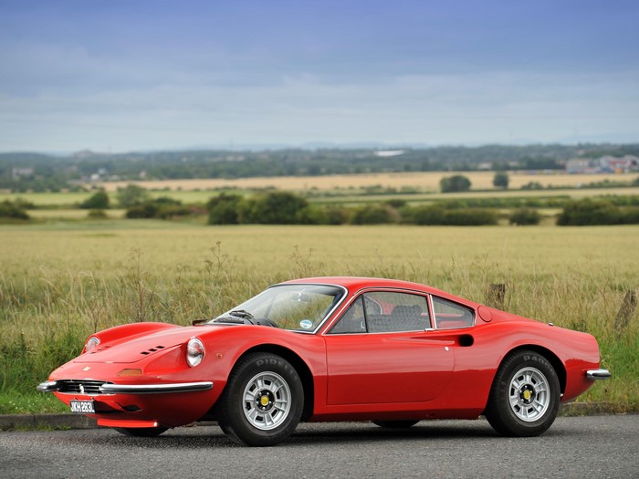 Red Ferrari Dino 246 GT on a Country Road