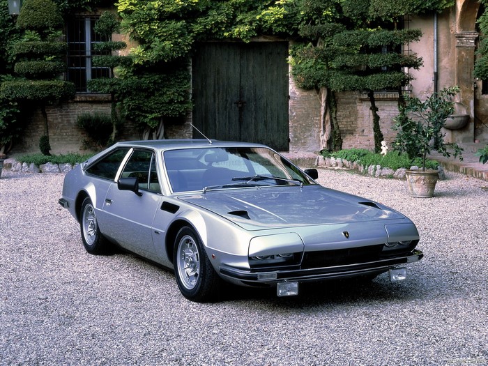 Silver Lamborghini Jalpa parked on gravel