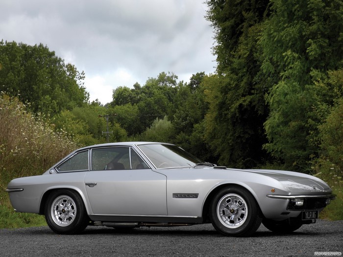 Silver Lamborghini Espada parked on gravel road
