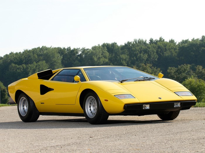 Yellow Lamborghini Countach parked on a road