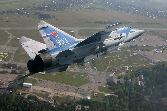 Russian MiG-31 fighter jet with missiles in flight