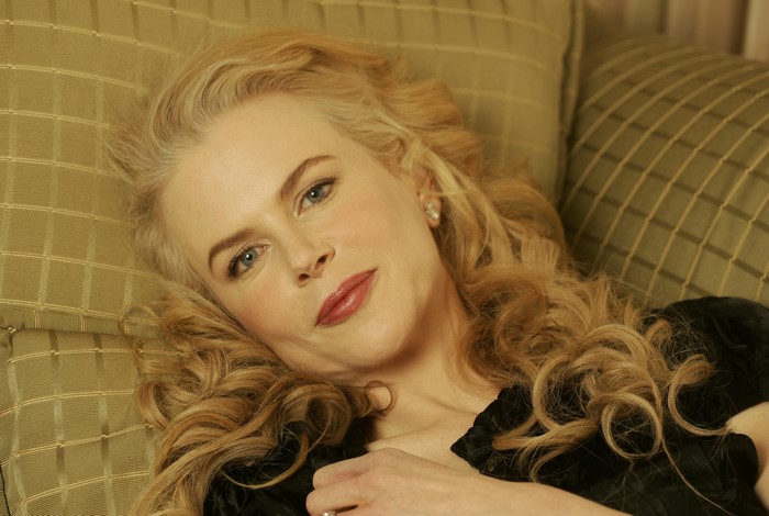 Nicole Kidman lying on a couch
