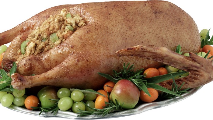 Roasted stuffed goose with fruits and herbs