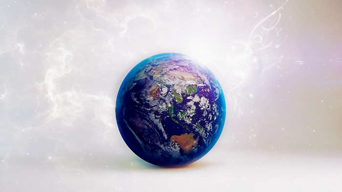 Earth floating in a bright, cloudy, cosmic background