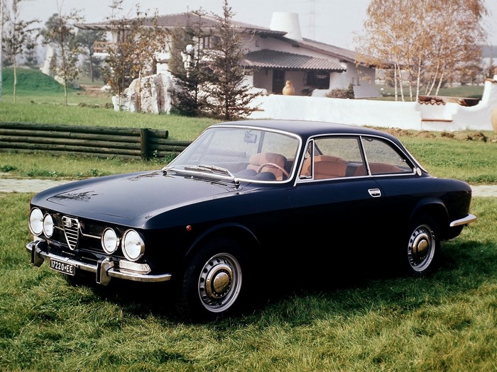 Black Alfa Romeo GT 1300 Junior parked on grass