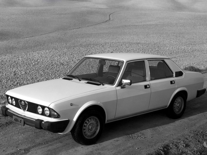Alfa Romeo 6 sedan parked on a dirt road