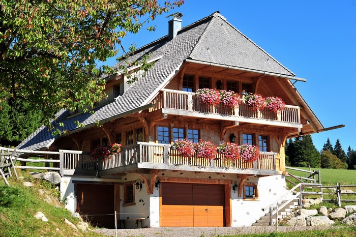 Wooden house with balconies and flowers in Germany