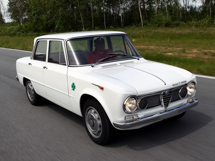 White Alfa Romeo Giulia driving on a road