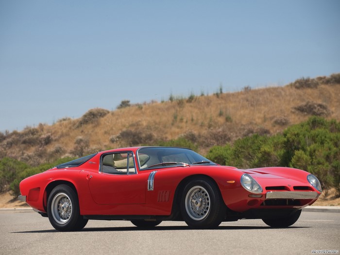 Red Bizzarrini sports car parked outdoors