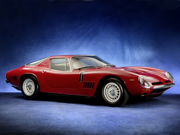 Red Bizzarrini sports car on blue background