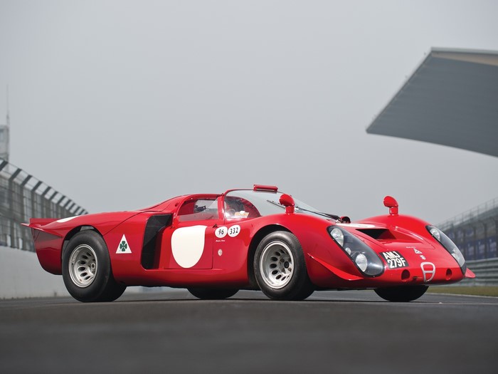 Red Alfa Romeo racing car on a track
