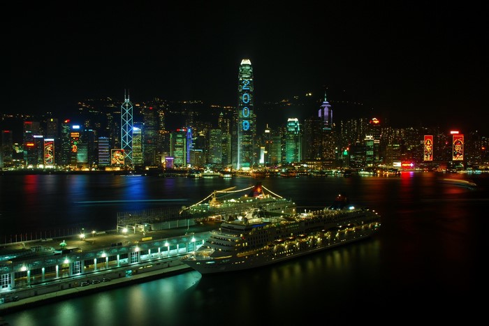 Hong Kong skyline at night with cruise ships