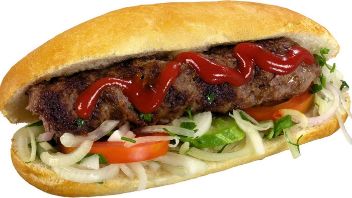 Hot dog with ketchup and vegetables