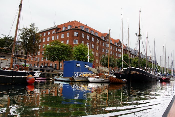 Boats docked in a canal in Christianshavn, Denmark