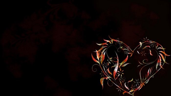 Heart shape with floral design on dark background