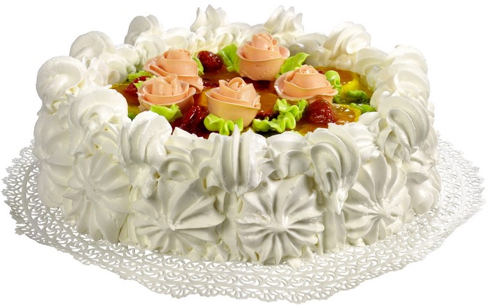 Decorated cake with cream roses and fruit