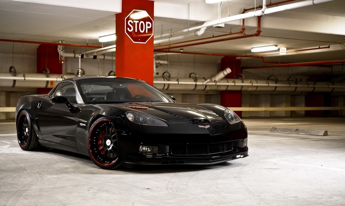 Black Chevrolet Corvette in Parking Garage