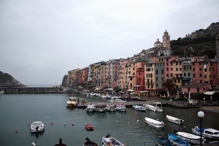 Colorful buildings and boats in a harbor in Italy