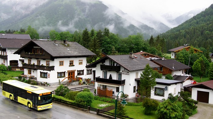 Yellow bus in a village in Austria