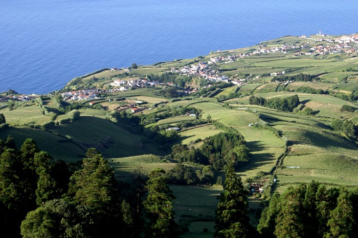Coastal village and rolling green hills in Portugal