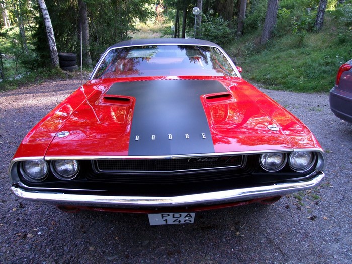 Red Dodge Challenger parked outdoors