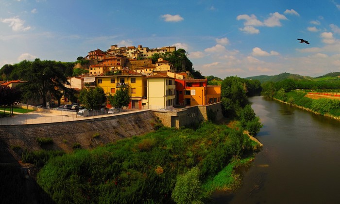 Italian town on a hill overlooking a river