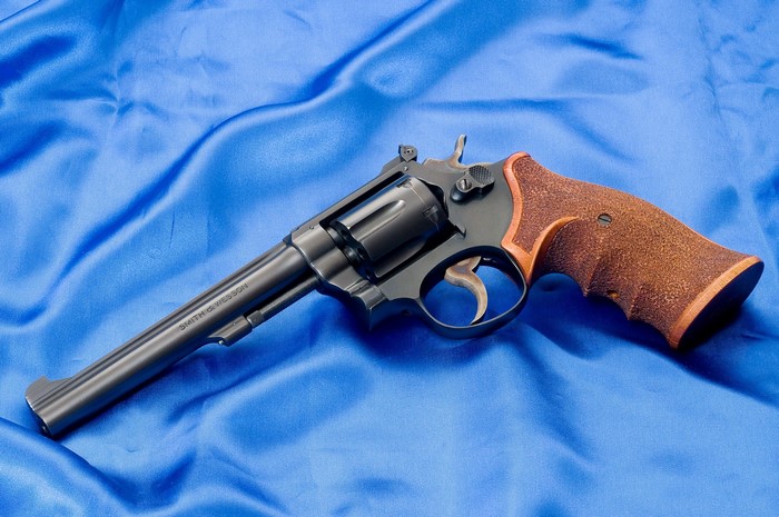 Smith & Wesson Revolver on Blue Fabric