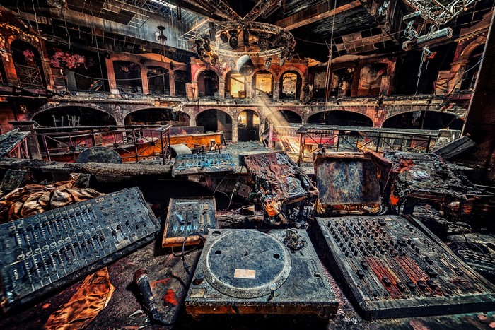 Abandoned nightclub with DJ equipment after a fire