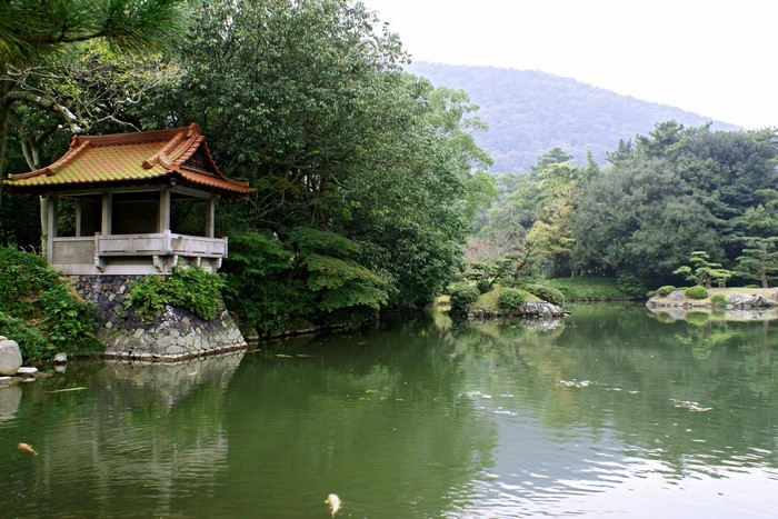 Ritsurin Garden in Japan with a pond and pavilion