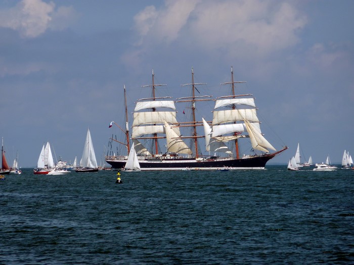 Tall Ship Sailing with Smaller Sailboats