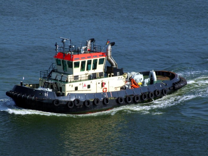 Tugboat sailing on the water