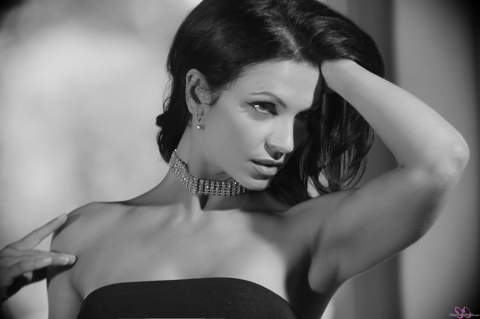 Denise Milani wearing a diamond choker