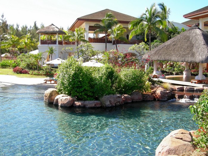 Resort with pool and tropical landscaping