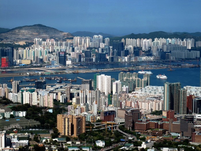 Hong Kong cityscape from above with mountains and harbor