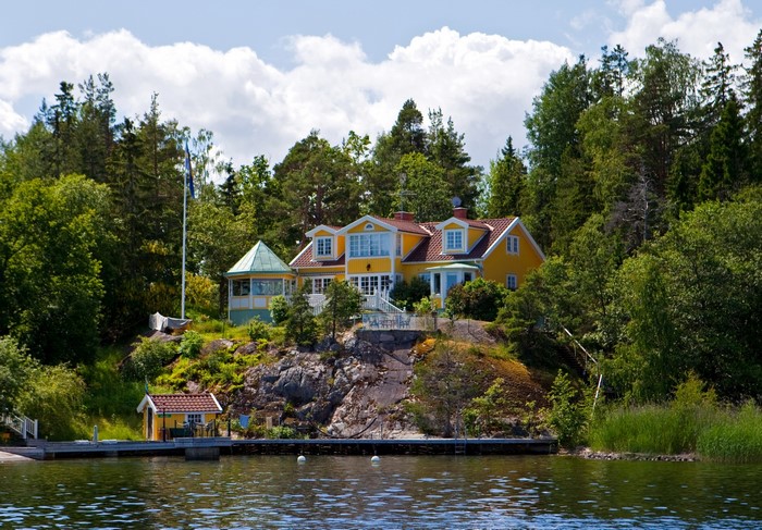 Yellow house on a rocky island in Sweden