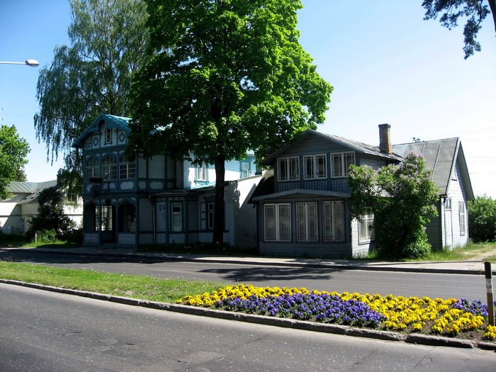 Two wooden houses with flowers in Jurmala, Latvia