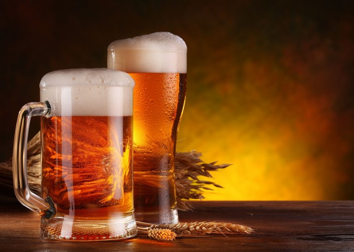 Two mugs of beer with wheat