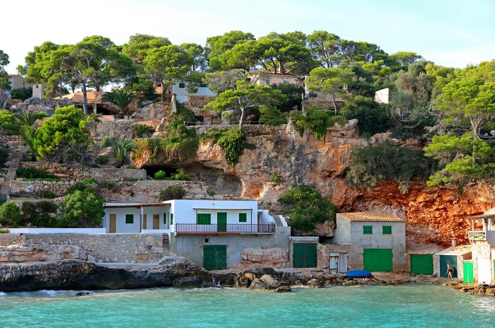 Coastal village with houses built into a cliffside in Spain