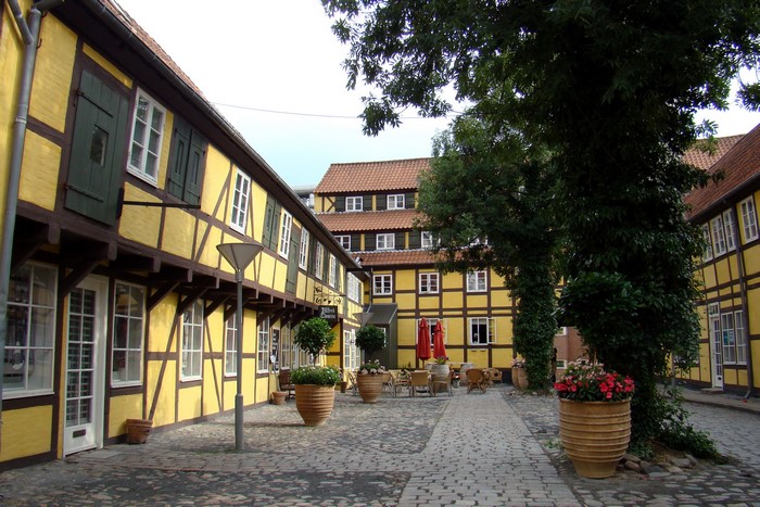 Half-timbered yellow buildings in Denmark courtyard