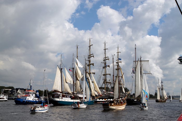 Tall ships and tugboat on the water